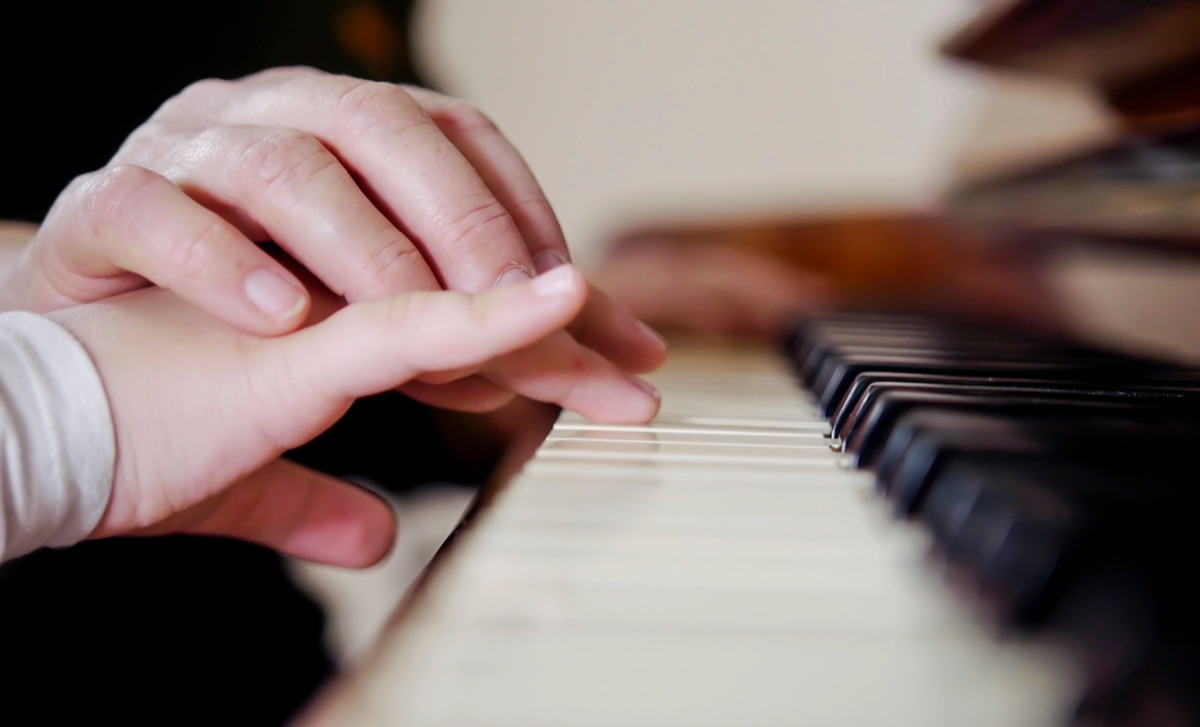 Hands on piano keys